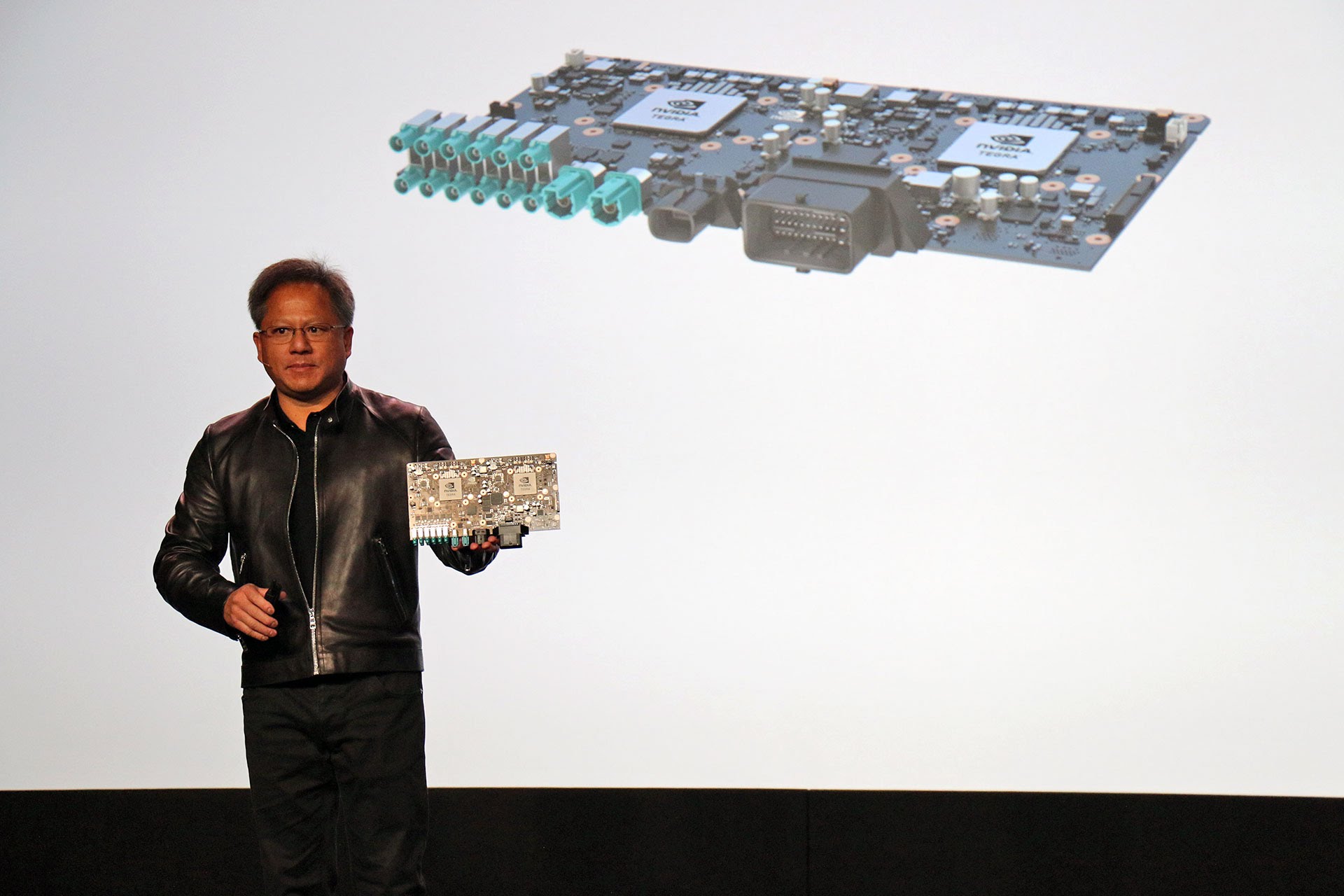 Huang with the Drive PX2 that is said to house dual GP105 chips